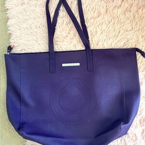 Purple large tote bag. Lightweight , used once. EUC . Use for Overnight bag.